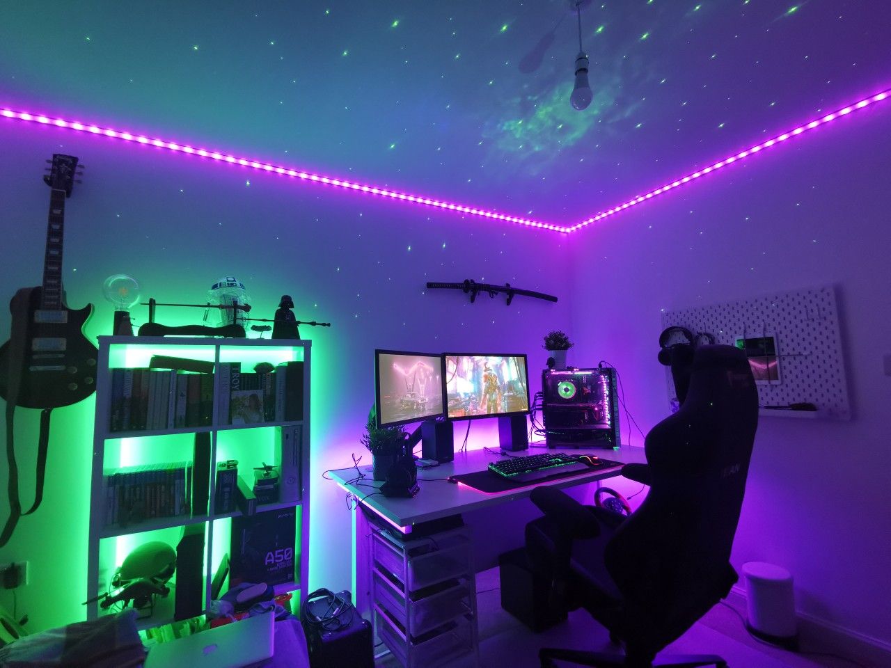 Modern minimalist dual-monitor gaming setup with ambient lighting